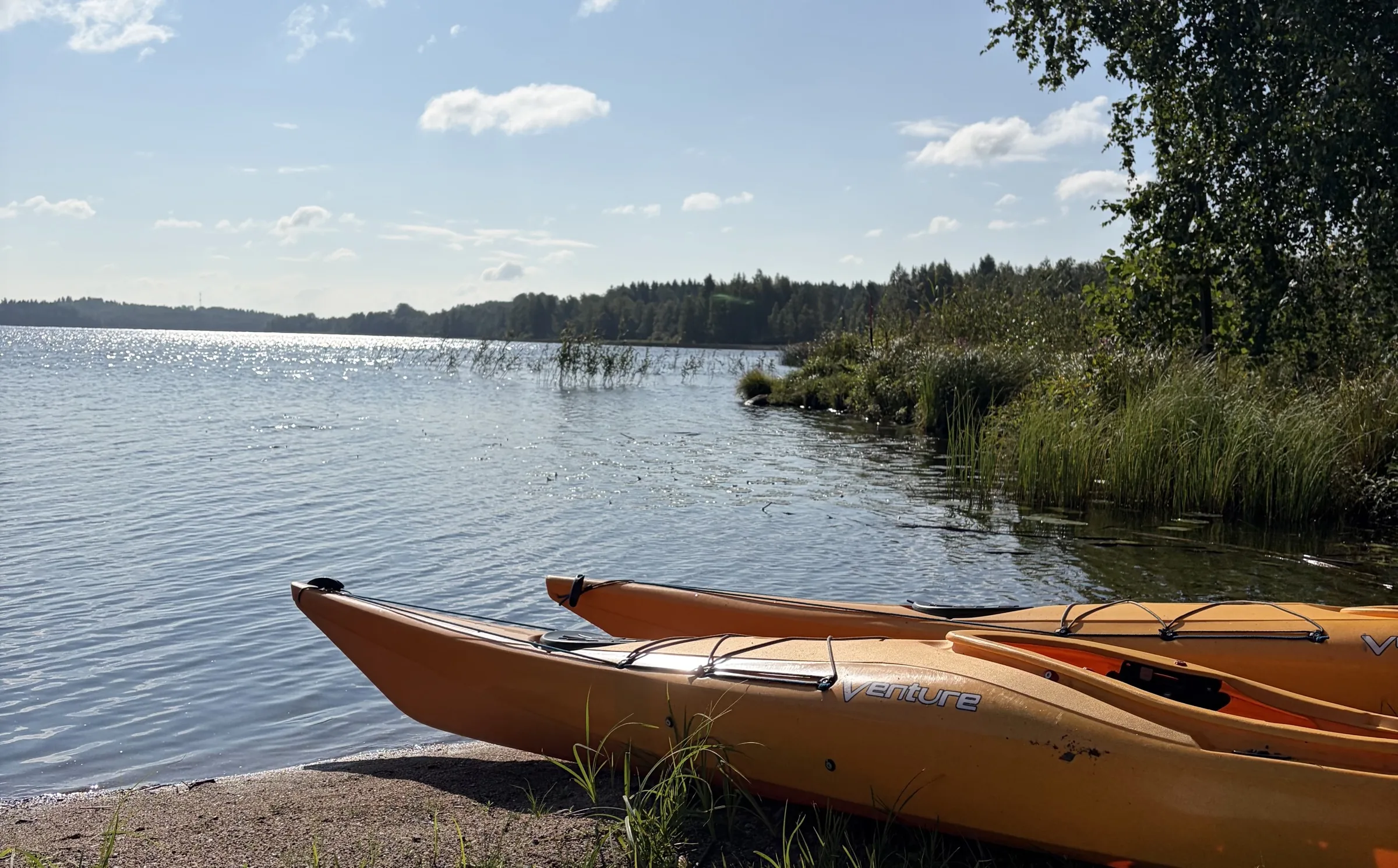 Kayaks ready to launch on Viralanjärvi at Taika Camping